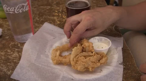 Female eats onion rings and drinks beer 02 Stock Footage 50360053