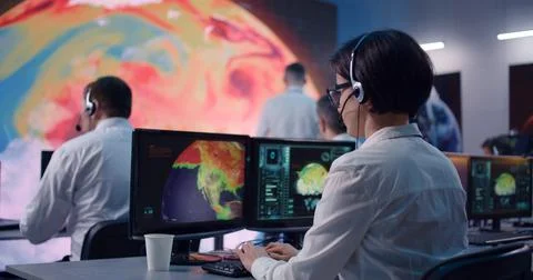 Female ecologist using computer and talking Foto stock