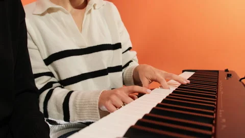 Female educator explains elements of etude to young student Stock Footage 277682562