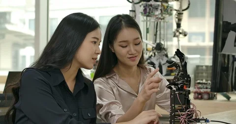 Female electronics engineer building, testing, fixing robotics in laboratory. Stock Footage 111831087