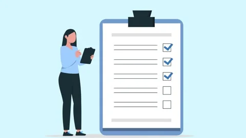 Female employee checking tasklist with clipboard in hand for checklist tick Stock Footage 308385378