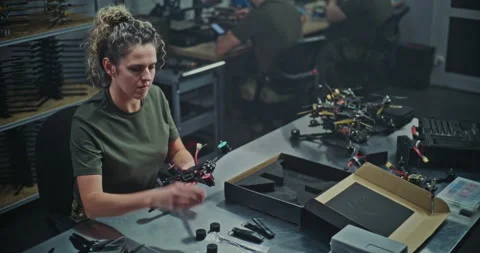 Female Engineer Assembling FPV Drone For Defense or Security Purposes Stock Footage 322108441
