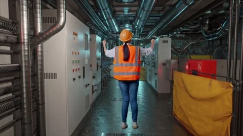 A Female Engineer Celebrating While Working In Engine Control Room Stock Footage 292372060