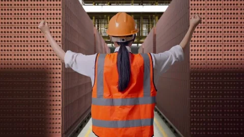 Female Engineer Celebrating While Working With Brick In Stacks Stock Footage 303762144