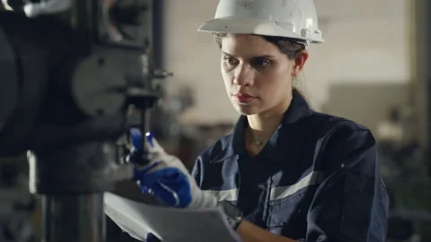 Female engineer checking and maintenance machine at factory. Stock-Footage 229405519