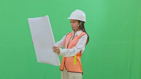 Female Engineer Checking Blueprint Green Screen Stock Footage 331152246