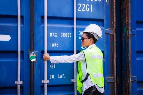 Female engineer checking containers box from cargo, Logistic concept Фото