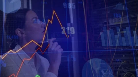 Female engineer checking handheld pointing at transparent finance charts rising Stock Footage 332591924