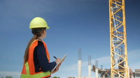 Female Engineer Checking off List at Construction Site, 4k Stock Footage 109464644
