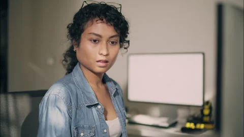 Female engineer contemplating in front of computer screen in modern office. Stock Footage 319001377
