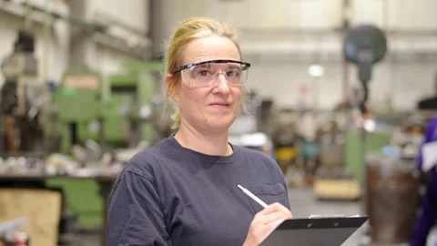 Female engineer controlling industrial process in the factory Stock Footage 259241101