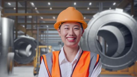 Female Engineer Crossing Her Arms And Smiling at Heavy Factory Stock Footage 340824656