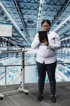 Female engineer designs integrated circuits layout using EDA software on tablet Stock Photos