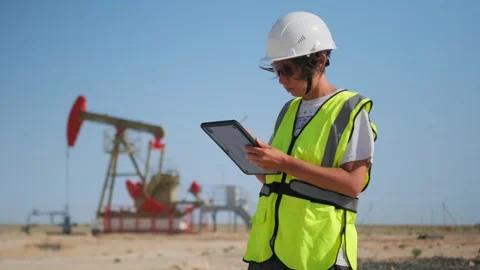 Female engineer with digital tablet at oil field 動画素材 317265280