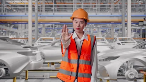 Female Engineer Disapproving With No Hand Sign In Car Factory Stock Footage 331631828
