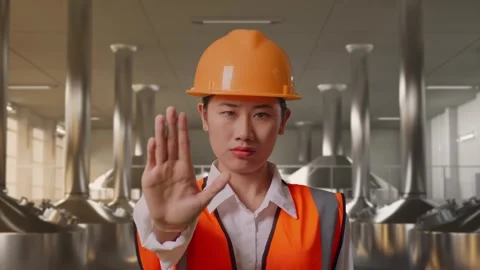 Female Engineer Disapproving With No Hand Sign at Beer Plant Stock Footage 332546700
