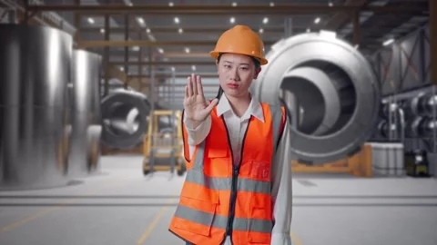 Female Engineer Disapproving With No Hand Sign at Heavy Factory Stock Footage 340822587