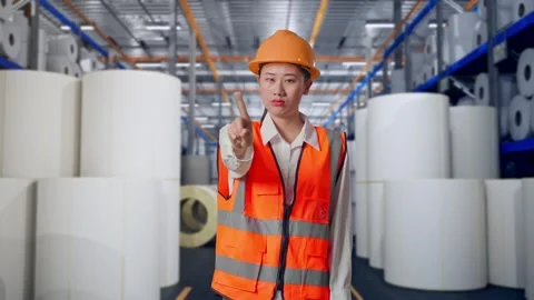 Female Engineer Disapproving With No Index Finger Sign at Polymer Plant Stock Footage 334529893