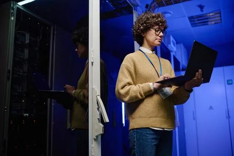 Female engineer examining data on laptop Stock Photos