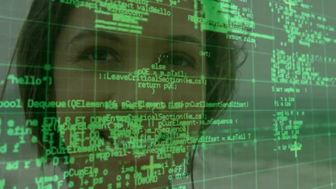 Female engineer examining green code overlay in tech interface with floating Stock Footage 309096846