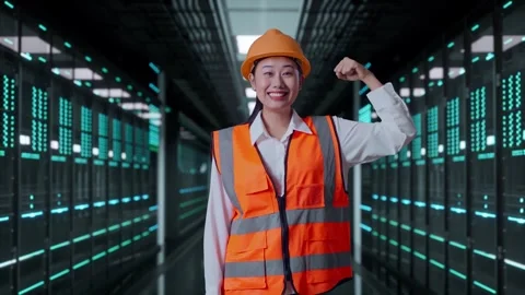 Female Engineer Flexing Her Bicep And Smiling in Data Center Video stock 321993539