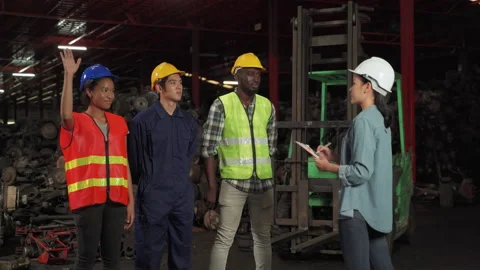 Female engineer as a foreman Checking worker names and explain descriptions Stock Footage 142456744