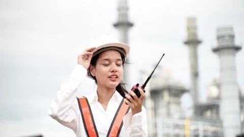 Female Engineer with Hard Hat and Walkie-Talkie at Industrial Power Plant. Stock Footage 279505352
