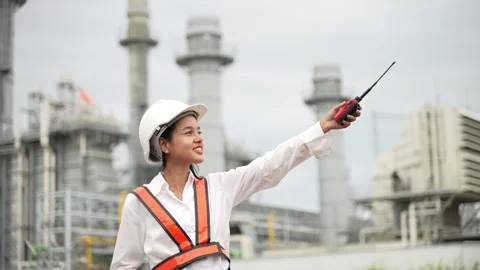 Female Engineer with Hard Hat and Walkie-Talkie at Industrial Power Plant. 動画素材 279505353