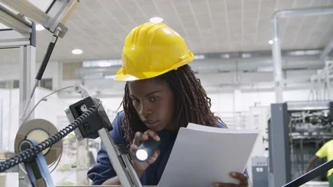 Female engineer holding document and checking machine 動画素材 147499439