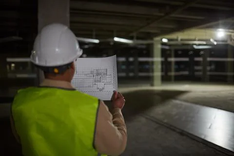 Female Engineer Inspecting Building Base Foto stock