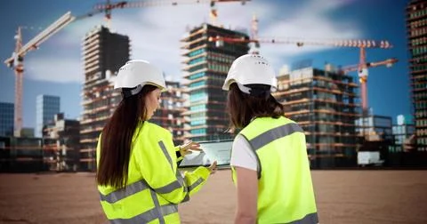 Female Engineer Inspecting Construction Site with Tablet 스톡 사진