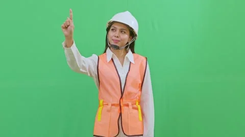 Female Engineer Interacting with Imaginary Hologram Menu on Green Screen Video stock 331625980