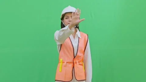 Female Engineer Interacting with Imaginary Hologram Menu on Green Screen Stock Footage 331626130