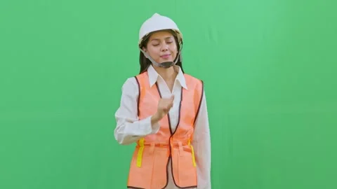 Female Engineer Interacting with Imaginary Hologram Menu on Green Screen Video stock 331626170