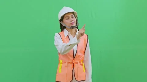 Female Engineer Interacting with Imaginary Hologram Menu on Green Screen Stock Footage 331626200