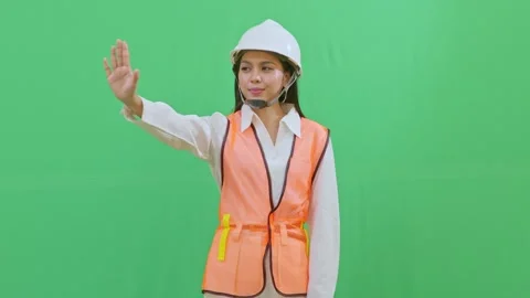 Female Engineer Interacting with Imaginary Hologram Menu on Green Screen Video stock 331626307