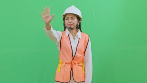 Female Engineer Interacting with Imaginary Hologram Menu on Green Screen Video stock 331626402