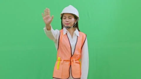 Female Engineer Interacting with Imaginary Hologram Menu on Green Screen Video stock 331626659