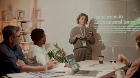 Female Engineer Leading Presentation on Climate Change during Office Meeting Stock Footage 300229252