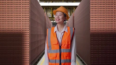 Female Engineer Looking Around With Brick In Stacks Stock Footage 303761484