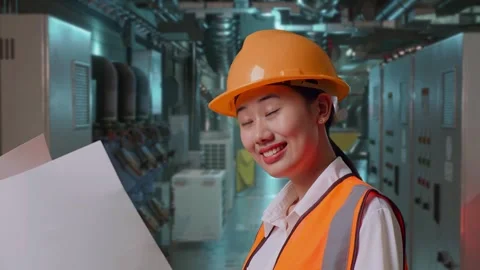 Female Engineer Looking At Blueprint In Her Hands In Engine Control Room Stock Footage 292370139