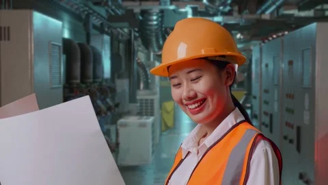 Female Engineer Looking At Blueprint In Her Hands In Engine Control Room Stock Footage 292370141
