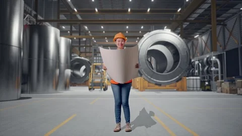 Female Engineer Looking At Blueprint In Her Hands at Heavy Factory Stock Footage 340826167