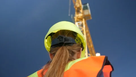 Female Engineer looking at Crane on Construction Site, 4k Stock Footage 109465118