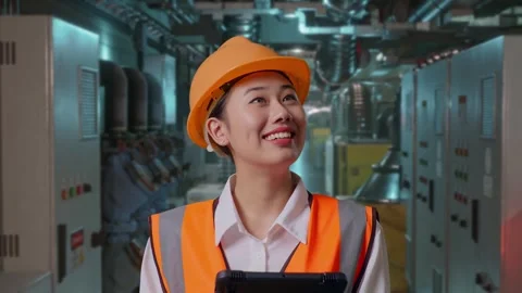 Female Engineer Looking At The Tablet In Her Hand In Engine Control Room Stock Footage 292369571