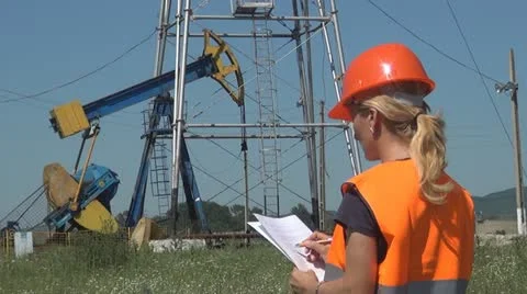 Female Engineer Make Notes Near an Oil Pump, Woman Working, People Stock Footage