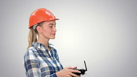Female engineer operating a drone analyzing object on white background Video stock 74217036