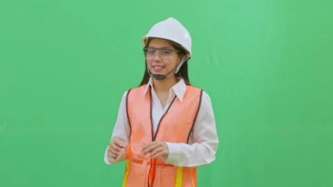 Female Engineer Pointing at Imaginary Safety Sign Green Screen Video stock 331864917