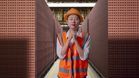 Female Engineer Pray For Something With Brick In Stacks Stock Footage 303761771