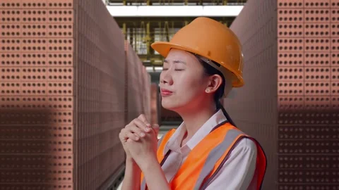 Female Engineer Pray For Something With Brick In Stacks Stock Footage 303762608